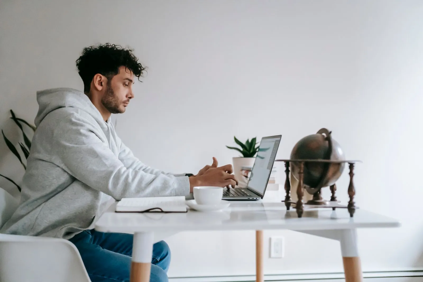 New freelancer using a laptop at home to search for a first client