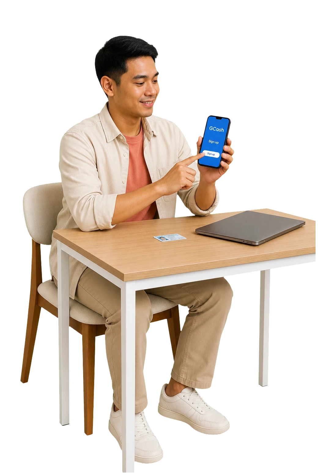 Filipino freelancer opening GCash on his phone with an ID and laptop ready