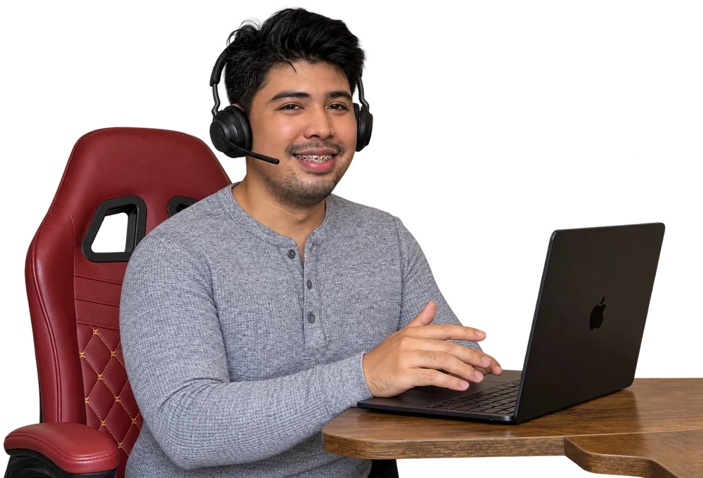 VA Starter Hub founder at a desk with a laptop and headset