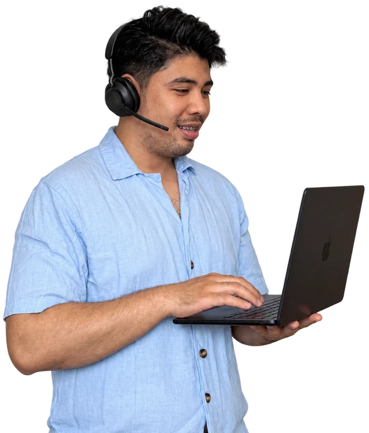 VA Starter Hub founder typing on a laptop while wearing a headset